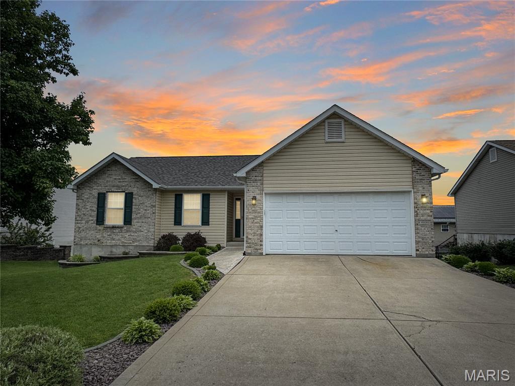 Spacious Ranch with a level driveway, 2-car garage, and approximately 2,733 total finished square feet, including 1,377 sq ft on the main level. This home offers a bright and open floor plan featuring an entry foyer, a vaulted great room, a spacious kitchen, and a dining area with access to a nice covered deck overlooking the backyard. The main level features a primary suite with a private bath, as well as two additional bedrooms and a hall bath. The finished lower level features a large family room with walk-out access and two windows bringing in great natural light. A storage shed in the backyard provides extra space for lawn equipment and tools. This is a must-see home with plenty of room inside and out!