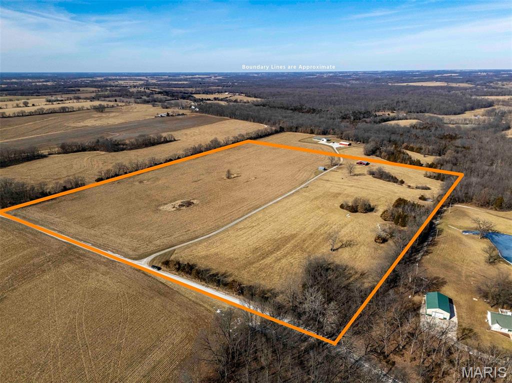33.15 Acres, Kuntz Road
Ideal 33.15 acres ideally located in northern Lincoln County; 20 min to Bowling Green, 20 min to Eolia, 30 min to Troy, and 1 hour to Chesterfield.  The property is a blank canvas for your custom home and homestead or turn it into a great smaller recreation and hunting piece. The past few years 18 m/l acres have been in crop production with the rest being cut for hay.  The land generally flat with a slight roll. A long driveway through the property will take you to your multiple building sites, saving you money. Electric is already on site as well as three outbuildings; a 20 x20 shop, 40 x 40 barn, and a small shed, great for kickstarting your homestead or storing tools and equipment. The is a great opportunity to build your dream home or just create a nice recreation piece outside St. Louis. The property is also being offered as a 20 and 13-acre tract. Light, thoughtful restrictions will be recorded at closing.