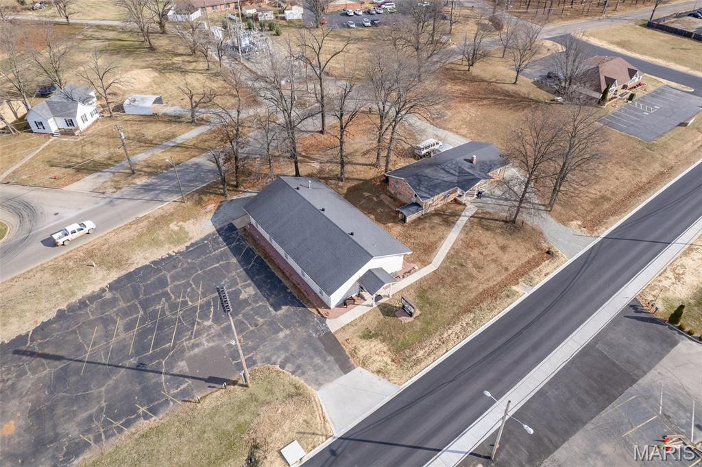 Over 1400 Linear foot of road frontage in just under 2 acres of a wedge of Weber intersection next to Maple Valley Shopping Center and Hwy 67. High traffic next to Lowes, Banking, Restaurants (Famous Catfish Kettle) and next to Karsch Blvd (running parallel).  This 3000 Square Foot Church with Parsonage with paved parking lot is in total of over 5000 square foot of commercial structure use. Location: City, Corner Location, High Traffic, Hwy/Interstate Frntg, Other, Retail Center