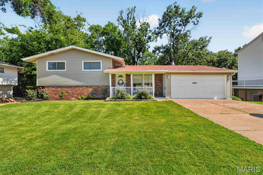 Welcome home to this beautifully maintained 4-bedroom, 2-bath home in the highly sought-after Lindbergh School District! Thoughtfully designed with flexibility in mind, the home offers a main-floor bedroom, three additional bedrooms upstairs, and a spacious bonus room in the walk out lower level that's perfect as a fifth bedroom, family room, playroom, home office, or whatever you want to make it! Inside, you'll find laminate flooring throughout and an updated kitchen featuring stainless steel appliances, making it both stylish and functional. Step outside to your own backyard retreat where a brand-new deck overlooks a wooded area, creating the perfect place to enjoy your morning coffee, unwind after a long day, or entertain friends and family. The newly landscaped backyard enhances the peaceful setting while providing plenty of space to enjoy the outdoors. Additional highlights include a 2-car garage, flexible living spaces, and a location that combines privacy with convenience to shopping, restaurants, parks, and highways. This move-in-ready home offers the perfect blend of comfort, space, and a serene backyard setting—don't miss your opportunity to make it yours!