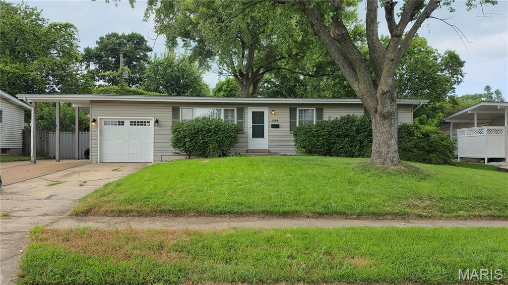Fantastic opportunity! This 3bd 2bth home is waiting for a little TLC and can easily become your dream home. The main level has three bedrooms along with a full bath, living room and eat in kitchen. Downstairs in the finished basement we have two more rooms that can be used as additional guest spaces or an office. A laundry room, wet bar with fridge along with living and dining area. This home sits on a double lot and has a HUGE yard with a shed, covered patio, another patio with firepit, carport and up to a six car driveway! The garage has access to the yard and plenty of room for storage. Weather you're an investor, first time home buyer or just someone who is looking to do an easy flip, this is the home for you!