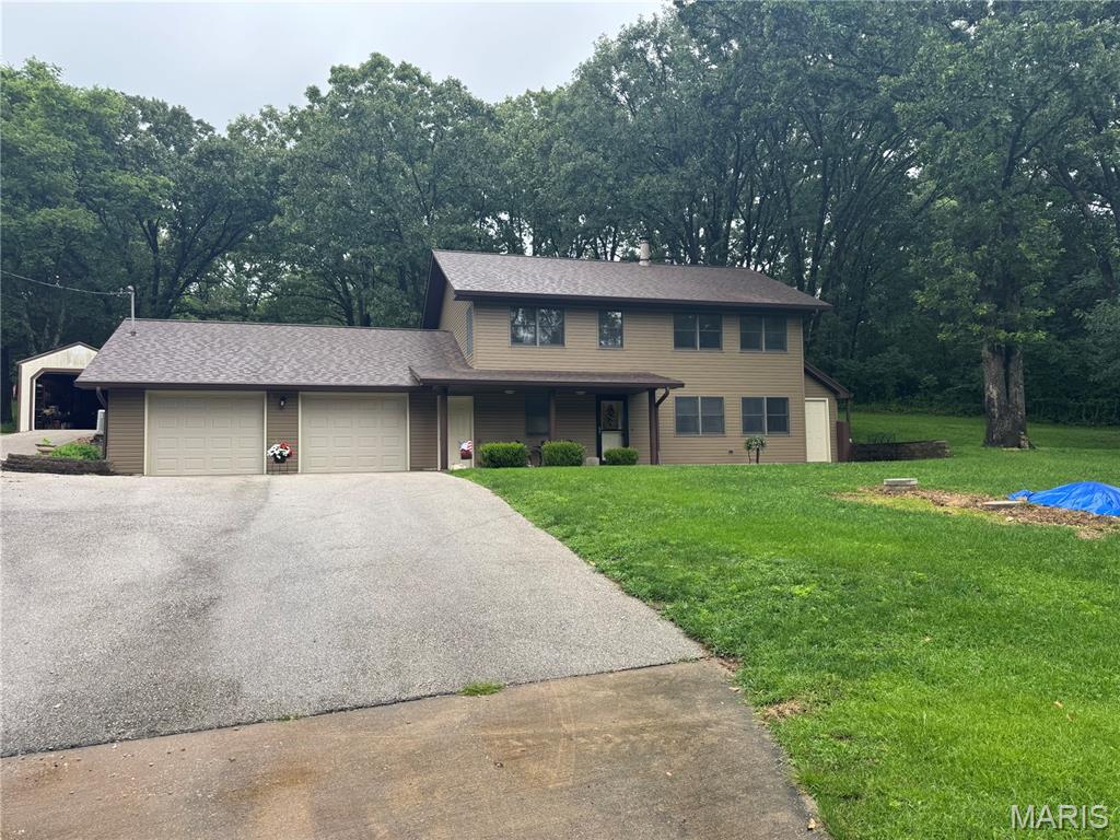 Welcome HOME! This inviting home offers the perfect blend of comfort, functionality, and location. Nestled in a desirable neighborhood, you'll enjoy convenient access to shopping, dining, schools, parks and the Franklin County Country Club. Inside you will find a bright and welcoming layout designed for everyday living. Spacious open floor plan on the main level,with full bath and laundry combo, 3 comfortable bedrooms and bath on the upper floor. Over sized 2 car garage and an additional shed are featured on this property also.