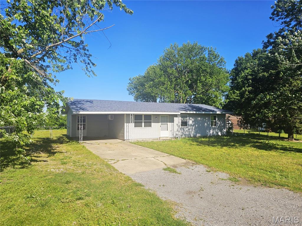 Welcome home to this inviting 3-bedroom, 1-bath ranch-style home offering 1,108 sq ft of comfortable living space, situated on a spacious 0.30-acre lot just outside the city limits. Enjoy the peace and quiet of a low-traffic neighborhood while still being conveniently close to town amenities.  This home features durable vinyl siding for ease of maintenance and a new flooring update that adds a fresh, modern touch throughout the interior. The layout provides a cozy and functional living space, ideal for first-time buyers, downsizers, or anyone looking for a place to make their own. Step outside to a covered deck in the rear, perfect for relaxing or entertaining, overlooking a fully fenced backyard—great for pets or outdoor gatherings.  With solid bones, recent updates, and excellent potential, this property is move-in ready and offers an opportunity to customize and add your personal touches over time.  Don’t miss your chance to own an affordable home with room to grow in a peaceful setting!