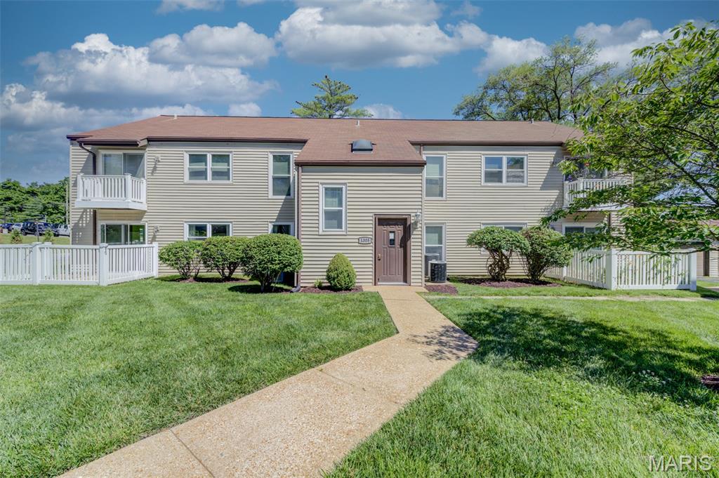 Move-in ready and beautifully updated, this spacious condo offers 1,169 sq. ft. of comfortable living space in the highly desirable Kirkwood School District. Luxury vinyl flooring flows throughout the home, creating a stylish and low-maintenance living environment. A beautiful entry foyer welcomes you into the home and opens to bright, inviting living spaces filled with natural light. The living room features a large glass slider leading to a private fenced patio and grassy area, perfect for relaxing or entertaining. The kitchen offers ample cabinetry, a large pantry closet with abundant shelving, and a second slider opening to an additional patio space. The oversized primary bathroom features an extended vanity, a separate toilet and shower room, and a spacious walk-in closet. A second full bathroom provides added convenience for guests or family members. Main-floor laundry adds everyday ease. Additional features include a private 1-car garage space, generous storage, and convenient access to shopping, dining, parks, and major highways. Move right in and enjoy carefree condo living!