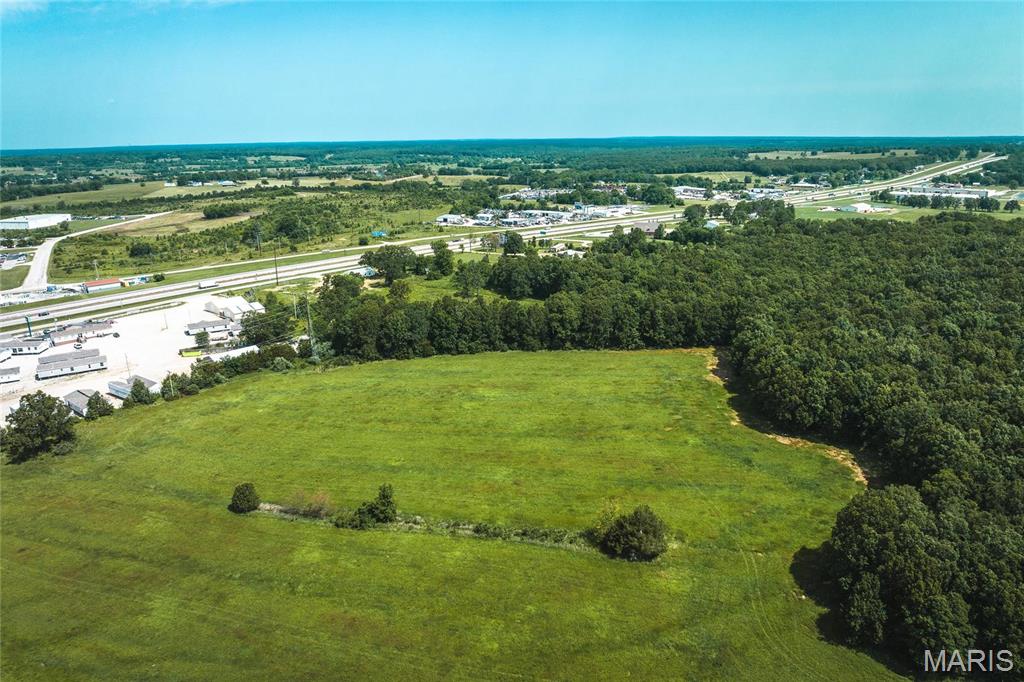 Located in Laclede County, just outside the city limits, presenting a fantastic opportunity for commercial development. With 33 m/l acres. Situated with excellent visibility from I-44, this property captures the attention of over 20,000 vehicles passing by daily, ensuring max exposure for any business or enterprise. The strategic location and high traffic count make it an ideal investment for those seeking a commercial venture. Located in Lebanon, Missouri, a rapidly growing economic and industrial community, this property is perfectly positioned for the city's thriving business environment. This property offers endless possibilities. The acreage allows for ample space to accommodate a building footprint. Additionally, the property benefits from convenient access to essential amenities, services, and utilities, making it an attractive choice for developers and investors. Don't miss this extraordinary opportunity to secure a prime location in the thriving community of Lebanon.
