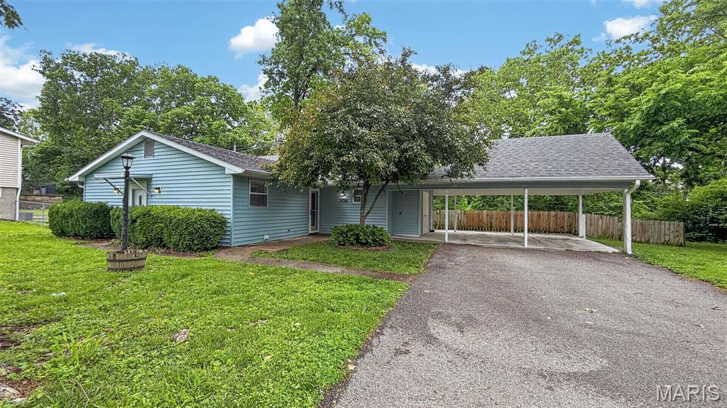 Back on the market due to no fault of Seller and a Brand new roof being installed as we speak! Open House sun., 6/14, 1-3pm  You will fall in love with this 2 Bedroom 1.5 bath charmer. Open floor plan - Great kitchen with Granite countertops and upgraded 42" soft close cabinets.  Center island, open to the Living Room.  The 2 bedrooms are divided with one having it's own private entrance. Updated baths. No Carpet in this Home w/lots of Ceiling Fans, six-panel doors and Windows!  Great Home Office area in the nice size Utility/Laundry room. Private backyard with lots of mature greenery, fenced in yard, .34/acre lot and a great patio for entertaining. The yard extends beyond the creek and offers great privacy. The home sits up higher than the creek and does not require flood insurance and has beautiful stone retaining wall.  The spacious 2 car carport includes a storage area. This is a fabulous location in a lovely neighborhood and just minutes to Hwy. 70, Hwy 364, and 370. 70. Refrigerator, washer and dryer are included in the sale. Super convenient location with Dierbergs, Schnucks, MidRivers Mall and tons of retail in short driving distance. Great schools of all varieties located nearby too!