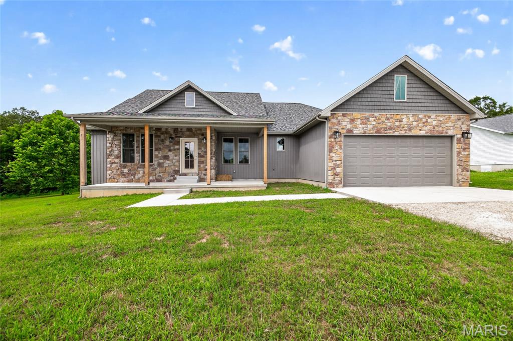 This brand new 4 bedroom, 2 bathroom home offers the perfect blend of modern style, comfort, and quality upgrades, all located in a highly desirable subdivision with a great yard to enjoy. Step inside to an inviting open layout featuring vaulted ceilings in the living room, 9-foot ceilings throughout the home, and a modern neutral color scheme that creates a bright and welcoming atmosphere. The spacious kitchen and living areas are ideal for both everyday living and entertaining. Outside, enjoy relaxing mornings on the covered front porch or evenings on the low-maintenance composite back deck. The primary suite is designed for comfort with double sink vanities, a relaxing soaker tub, and a large walk-in closet offering plenty of storage space. With thoughtful upgrades throughout and beautiful curb appeal, this home is move-in ready and built to impress.