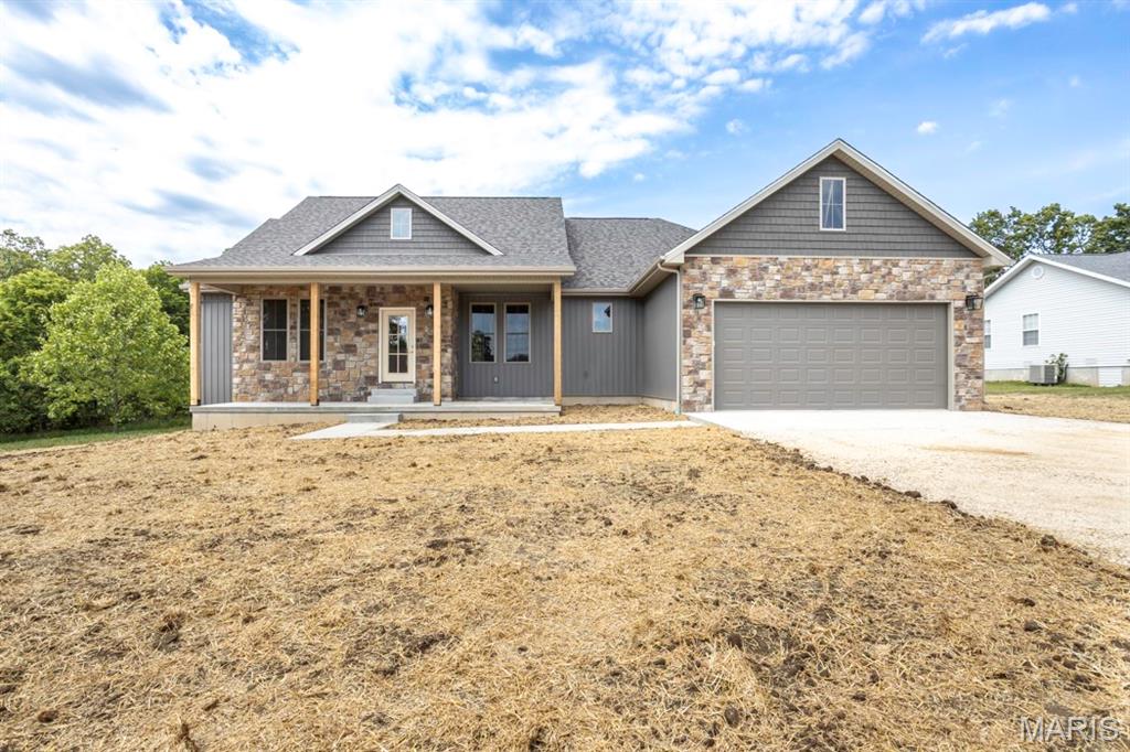 This brand new 4 bedroom, 2 bathroom home offers the perfect blend of modern style, comfort, and quality upgrades, all located in a highly desirable subdivision with a great yard to enjoy. Step inside to an inviting open layout featuring vaulted ceilings in the living room, 9-foot ceilings throughout the home, and a modern neutral color scheme that creates a bright and welcoming atmosphere. The spacious kitchen and living areas are ideal for both everyday living and entertaining. Outside, enjoy relaxing mornings on the covered front porch or evenings on the low-maintenance composite back deck. The primary suite is designed for comfort with double sink vanities, a relaxing soaker tub, and a large walk-in closet offering plenty of storage space. With thoughtful upgrades throughout and beautiful curb appeal, this home is move-in ready and built to impress.