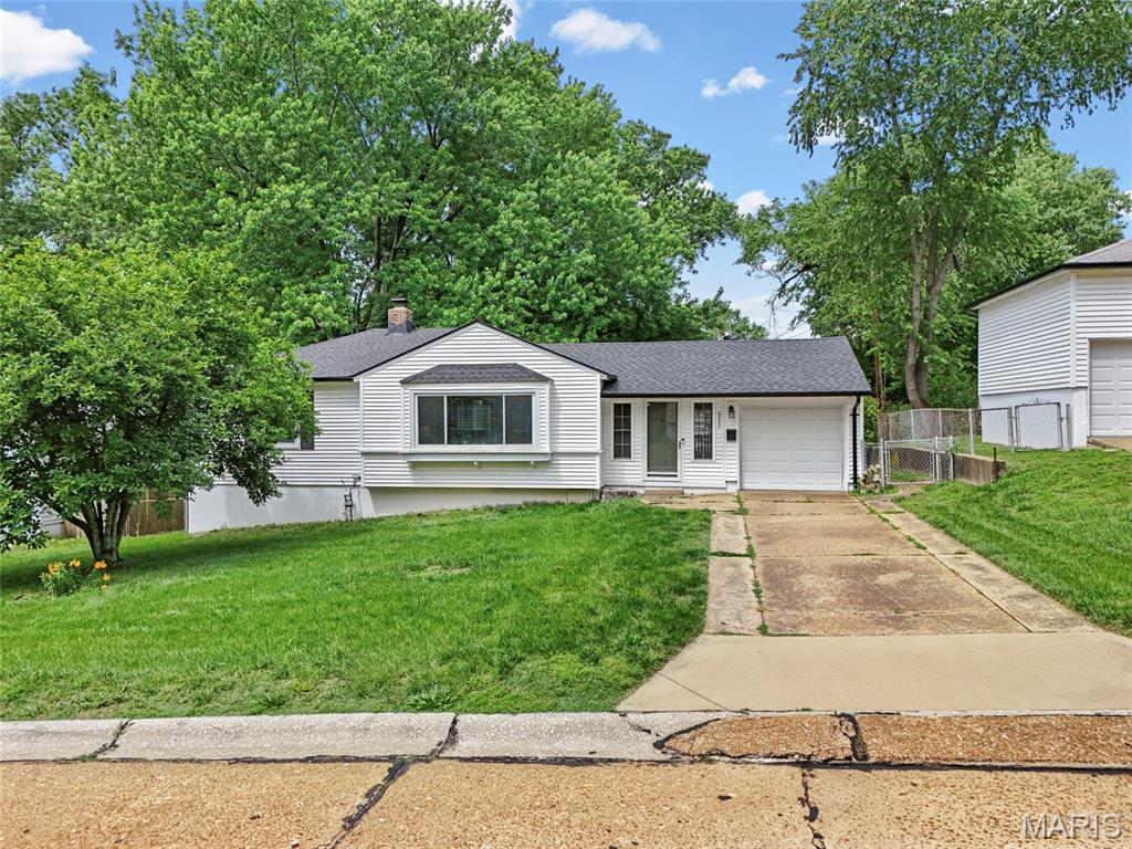 Welcome to 9557 Cantwell Drive in Affton. This 2 bed, 2 bath home comes with an attached garage and has key updates already handled. The main floor offers a spacious entry foyer with flexible sitting space and french doors leading to the deck and fenced, level backyard. The living room is bright and welcoming, with a wall of windows and natural light. The kitchen provides plenty of counter space and cabinet storage, with all kitchen appliances included. A dining room, two bedrooms, and a full bath complete the main level, with hardwood and ceramic tile throughout. The finished lower level adds even more room to spread out with a rec room, a flexible bonus space with a large walk in closet (that could be used  an office) another bonus room, full second bath, plus a washer and dryer that stay. Outside, the level fenced yard offers plenty of room for entertaining and for the pets to run. Updates include a new roof and gutters in 2025, new water heater in 2024, and newer windows throughout.