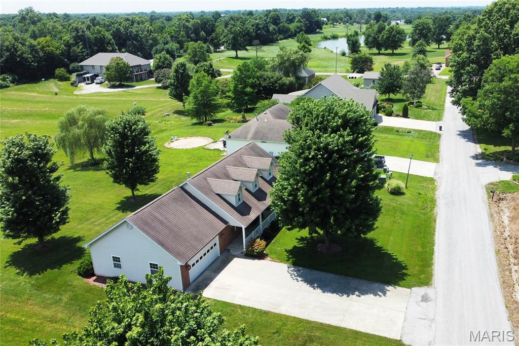 Welcome to one of Eagle Estates' most desirable locations! This beautifully maintained 3-bedroom ranch offers the perfect combination of quality construction, exceptional care, and an outstanding setting just a short walk from the Montgomery County Golf Course.

Built in 2005, this home has been meticulously cared for and it shows from the moment you arrive. Attractive landscaping, excellent curb appeal, and a welcoming front porch set the tone before you even step inside.

The spacious main level is filled with natural light thanks to true dormer windows, creating bright, inviting living spaces rarely found in homes of this style. The thoughtful floor plan offers comfortable everyday living with generous room sizes and an attached oversized two-car garage.

Downstairs, the full basement is a standout feature. No foundation cracks...something Missouri homeowners know is increasingly uncommon...giving buyers confidence and a fantastic opportunity to finish additional living space, create a workshop, home gym, or simply enjoy abundant storage.

The location is just as impressive as the home itself. With no homes directly in front or behind, you'll enjoy open, unobstructed views and an added sense of privacy that's difficult to find in a subdivision. Combined with easy access to the golf course and a quiet, established neighborhood, this is a property that truly stands apart.

Homes that have been this well cared for, in a location like this, don't come available often. Schedule your private showing today and experience everything this Eagle Estates home has to offer.