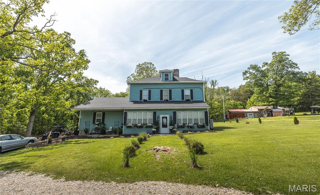 Welcome to the perfect blend of historic charm and modern comfort in this beautifully remodeled 2-story home in Jerome, MO. Nestled on 1.12 acres, this property offers the space, privacy, and lifestyle families are looking for—surrounded by nature yet thoughtfully updated for today’s living. Step inside and you’ll immediately feel at home. Luxury vinyl plank flooring flows throughout the main areas, creating a warm and inviting atmosphere. The kitchen is designed for both everyday living and gathering, featuring stainless steel appliances and a layout that keeps everyone connected. A separate dining room provides the perfect setting for family meals, holidays, and special occasions.
One of the standout spaces is the sunroom—filled with natural light and ideal for relaxing, working from home, or simply enjoying peaceful views of the property year-round. With five bedrooms and two full bathrooms, there’s room for everyone to spread out comfortably.
Outside, the backyard patio is ready for entertaining, while the acreage offers endless possibilities for play, gardening, or simply enjoying the outdoors. Located close to the Jerome boat access and river, and surrounded by conservation land, this property is a dream for families who love fishing, hunting, camping, or exploring nature. If you’ve been searching for space, character, and a true outdoor lifestyle, this home delivers. Schedule your private showing today and experience it for yourself!
