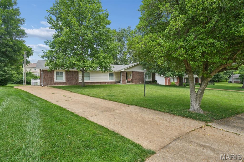 This charming, beautifully updated ranch delivers the perfect mix of style, comfort, and versatility. Refinished red oak hardwood flooring flows throughout the open floor plan, creating a bright, seamless space perfect for everyday living and entertaining. The stunning updated kitchen takes center stage with quartz countertops, soft close custom cabinetry, stainless appliances, and a farmhouse sink that adds the perfect touch of character. The split bedroom layout offers ideal privacy with a spacious primary ensuite on one side and two additional bedrooms with a hall bath on the other. Need even more flexibility? The main level office can easily serve as a bedroom — the only thing it’s missing is a closet. Newer plantation shutters, a bay window, and a skylight bring in beautiful natural light and timeless charm. The finished lower level expands your living space with a large rec room and two additional sleeping areas, giving you endless options for guests or hobbies. Outside, the fully fenced backyard is ready for play, pets, and outdoor fun, complemented by fresh front landscaping planted in June 2025. With newer plumbing and updated electric and a new roof installed on June 10, 2026, the big-ticket items are already taken care of. Stylish, updated, and full of flexible living spaces — this ranch checks every box for today’s buyers.