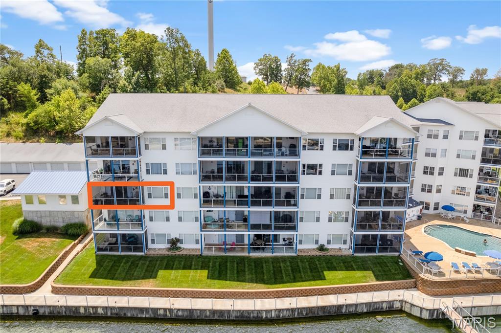 ONE of a KIND! Best describes this TRULY Unique unit's VIEW and Complex Amenities! This 3rd Floor End Unit has been totally renovated to offer an unmatched Lake experience! Updates Incl. Windows (w/Remote Blinds), HVAC, Appliances, Flooring and Much, Much More! Be Sure to review the extensive Update LIst! A Large Deck is yours to enjoy the amazing view! Elevator Access and a Screened Deck, Nestled in a quiet, deeper cove area that has easy access to restaurants, gas docks and the main channel. 2 swimming pools (1 fresh, 1 saltwater) 2 dedicated swim platforms (1 with kayak launch), an exercise facility, fenced playground (with basketball & pickleball courts), and some of the best fishing at the lake will surely keep your family and guests entertained! Unit includes a 12 x 36 slip with Slip Rollers, Ship/Shore power & in a well lit and maintained dock equipped with features such as water, electric, security cameras and fish cleaning stations. There is an Optional Garage available for an additional 45K. This complex is meticulously manicured and pet friendly! The boardwalk is great for evening strolls and enjoying the lake views! Friendly neighbors and events are just some of the reasons that make Blue Anchor Bay one of the most sought after condominium destinations at Wonderful Lake of the Ozarks!