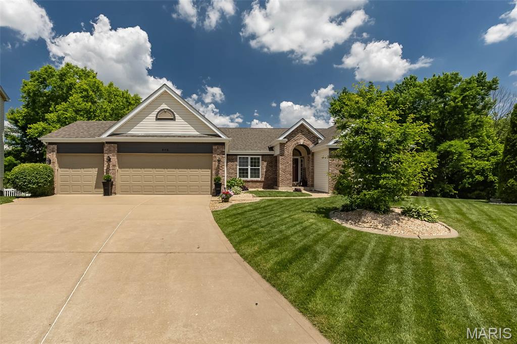 Meticulously updated 4-bedroom ranch situated on a large walk out lot with a gorgeous water view in sought after Fieldstone Farms! This stunning home features gleaming wood floors and a fabulous open floor plan perfect for entertaining! Dining room opens to the large great room complete with vaulted ceilings, gas fireplace. Kitchen features 42" custom cabinets, granite countertops, breakfast bar, stainless steel appliances, dual pantries and sliding doors to maint. free deck which overlooks the beautiful, fenced lot backing to the pond and woods. Main floor master suite boasts a walk-in closet, bath with separate soaking tub and marble surround shower & double sinks. Two large bedrooms, bonus room/ office, full bath and laundry room complete the main floor. Walk out lower level includes aggregate concrete flooring, rec room, exercise room, 4th bedroom and full bath. Updates galore-newer appliances, custom ceiling in LL, new roof, fascia, downspouts, and the list goes on! Fabulous location just minutes to Hwy 40!