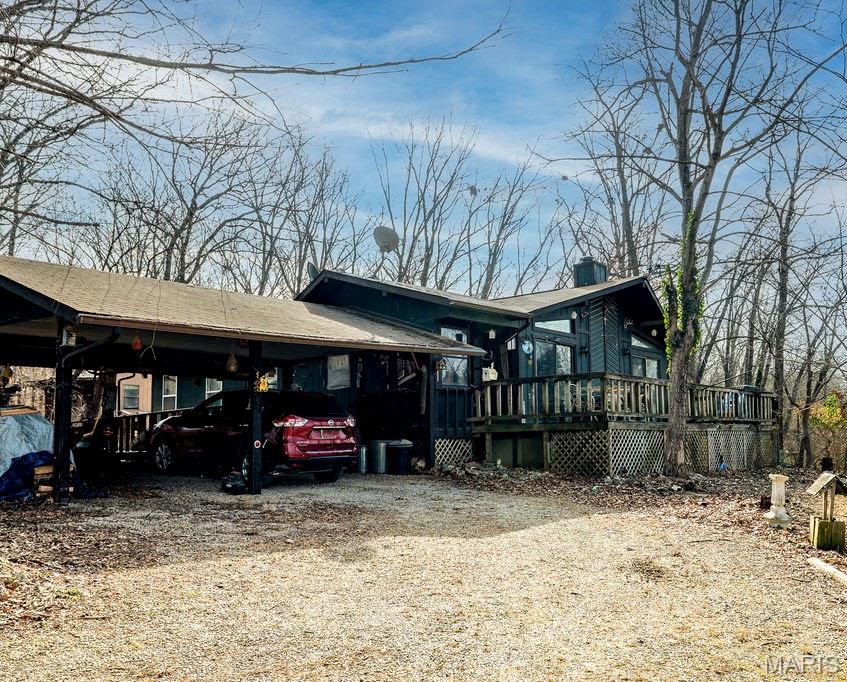 This well loved 3-bedroom, 2-bath home spans over 1500 square feet—all on one level for effortless, accessible living. Nestled on an oversized lake lot with four adjoining lots totaling 1.25+/- partially wooded acres, this property offers unparalleled privacy and expansion potential. Imagine adding garages, a workshop, guest quarters, or your dream outdoor oasis—plenty of space to make it yours!
Open-concept layout with ample living space, ideal for families, retirees, or anyone seeking main-floor convenience—no stairs required.
Overlook serene Silver Lake from the expansive deck and oversized picture windows, perfect for morning coffee or sunset watching.

1.25 acres provide flexibility for shops, RV parking, gardens, or additional structures amid mature trees.

Live the lake life in Lake Timberline, a secure gated enclave boasting multiple lakes for boating, swimming, fishing, and more. Enjoy community perks like clubhouses, and social events, etc.—all while maintaining your peaceful retreat.
