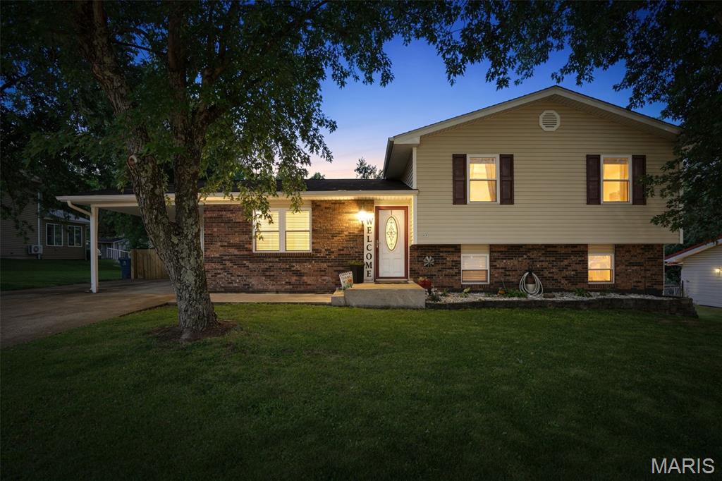 Welcome Home! This beautiful 3 bed 2 bath home blends timeless brick and vinyl siding with an incredible package of space, comfort, and small-town charm. You are invited into the living area that welcomes you in with Rich, high-gloss cherry-toned hardwood floors providing a sophisticated finish that catches the light beautifully. The kitchen is bright with natural light offering a functional layout with abundant rich wood cabinetry. Walk right out of the kitchen and into a backyard oasis. With a vast, flat fenced in lawn, it is perfect for entertaining and has ample space for future additions like a fire pit, large garden beds, or even a swimming pool. More pictures coming soon!