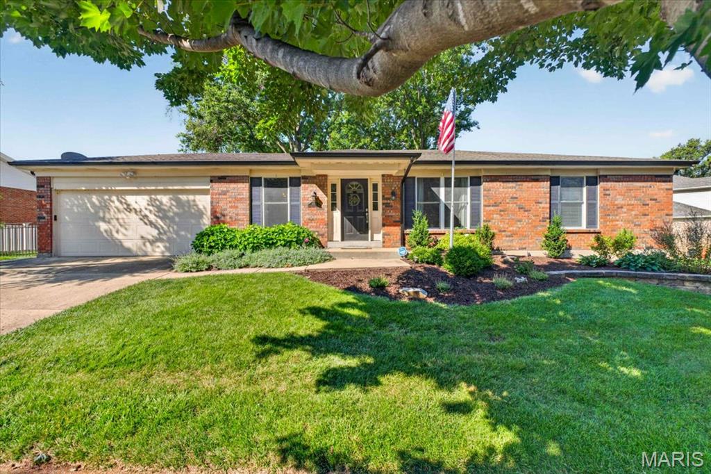 This all-brick ranch home in South County offers 4 bedrooms, 2 full bathrooms, and a spacious layout designed for comfortable everyday living.

Step inside to a bright living room that flows seamlessly into the open kitchen and dining area. The dining space features a cozy fireplace and sliding glass doors leading to the back patio, creating the perfect setup for entertaining or relaxing. The kitchen offers an abundance of cabinet space, a breakfast bar, and plenty of room for meal prep and gathering with family and friends.

All four bedrooms are generously sized, with some featuring walk-in closets for added storage. The primary suite includes a private bathroom complete with a separate soaking tub and shower.

The partially finished lower level provides even more living space with a family room, sleeping area, office or den, giving you plenty of flexibility to fit your needs.

Outside, you'll enjoy the back patio, mature trees that provide shade and privacy, and an attached 2-car garage. Additional updates include a newer air conditioning system (2019) and furnace (2024),hot water heater (2019), offering added peace of mind.

If you're looking for space, functionality, and a well-maintained all-brick home in South County, this one is ready to welcome you home!