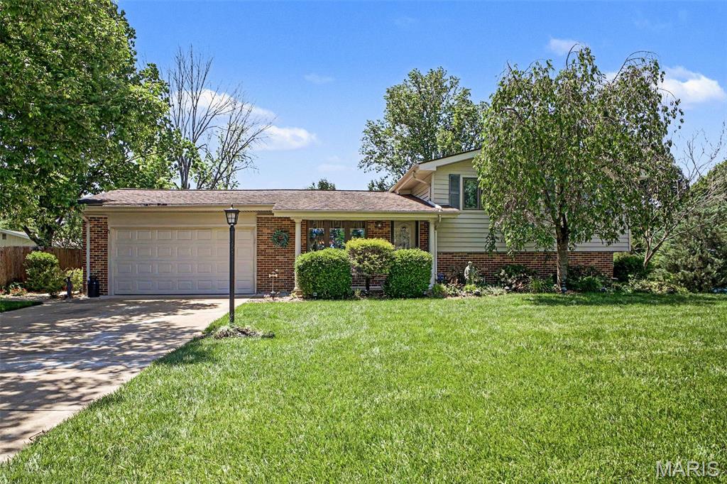 Welcome to 4912 Arevalo Court!  With over 2000 Sq Ft of Finished Living Space, this tri-level home offers a unique combination of level living to suit your needs. The Main Level begins as you enter this well maintained home and greeted into the Living Room with beautiful Hardwood Flooring leading to the separate Dining Room. Adjoining, is the Eat In Kitchen with Stainless Steel Appliances, Solid Surface Countertops and Plentiful Cabinetry. The Upper Level is just several steps up and features 3 nicely sized Bedrooms and an updated Full Bath with a newer jetted Walk In Tub for ultimate relaxation. The Lower Level hosts a spacious Family Room, a Full Bath, Laundry Area, Walk Out access, and an unfinished area for your storage needs. Let's not forget the Backyard! With an extended Patio, Retractable Awning, KitchenAid Natural Gas BBQ Grill, and a landscaped and manicured yard, outdoor entertainment is ready for family and friends! Nestled on a quiet Cul de Sac, located in the Mehlville School District, and close to shopping, dining, parks, and major highways for commutes. Come see for yourself what this wonderful home has to offer!