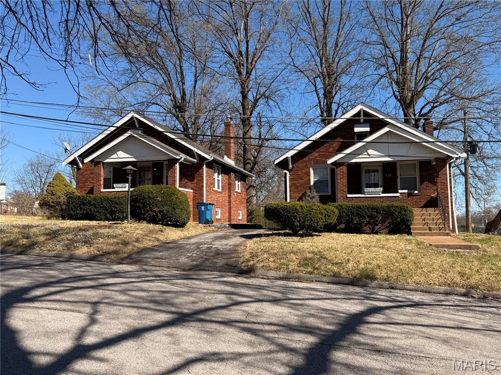 Two identical brick bungalow homes situated on one parcel, along with an additional vacant lot—offering excellent investment or multi-generational living potential. A detached two-car garage is located at the rear of the property, providing convenient parking and additional storage. Both homes feature newer thermal windows installed by Window World and updated architectural shingle roofs. Solid brick construction adds durability and classic curb appeal. The extra lot provides room for expansion, new construction, or added outdoor space. A unique opportunity with flexibility for investors or homeowners alike.
Both homes are currently occupied by tenants.