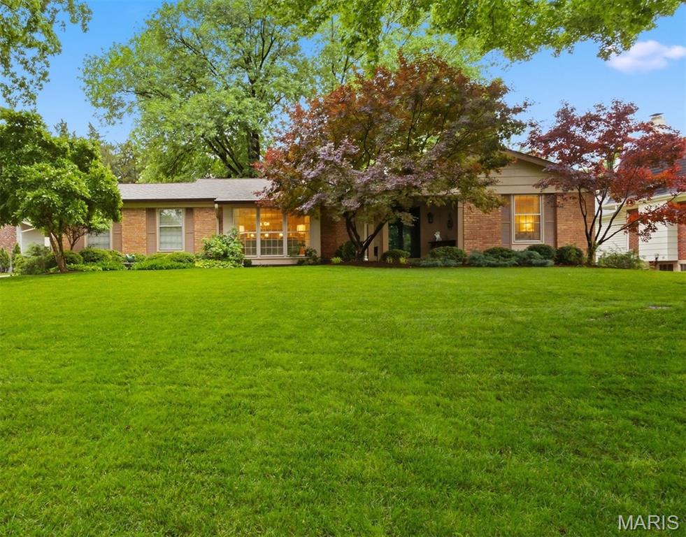 Beautifully maintained traditional ranch just minutes from the golf course that hosted the historic 100th PGA Championship. This move-in ready home has been meticulously maintained and thoughtfully designed, offering inviting living and entertaining space inside and out. The manicured landscaping, aggregate driveway with extra parking, rear-entry garage, and welcoming covered front porch provide outstanding curb appeal. A lovely entry foyer leads to a formal living room and dining area then flows into an updated kitchen featuring premier stainless appliances, double ovens, microwave/convection oven, 5-burner gas cooktop, granite countertops, travertine backsplash, and a center island with seating. The open floor plan is filled with natural light, highlighted by a stunning cozy family room! A stunning sunroom with a wall of windows overlooks the large patio, firepit and backyard oasis with exterior lighting. The elegant and spacious primary suite includes a walk-in closet, an additional double closet and a spacious primary bath with double vanities. The finished lower level is designed for entertaining, complete with media and recreation rooms, wet bar with full-size sink and beverage station, custom cabinetry, center island, media room and built-in bookshelves. A private office with French doors and built-in desk includes a walk-in cedar closet. Additional lower-level features include a sleeping room with double closets, full bath and laundry room. Additional features include a sound system throughout the main level and patio, sprinkler system and a convenient location close to shopping, dining, and major highways. A rare opportunity to own a charming, exceptionally cared-for home in one of the area’s most sought-after neighborhoods.