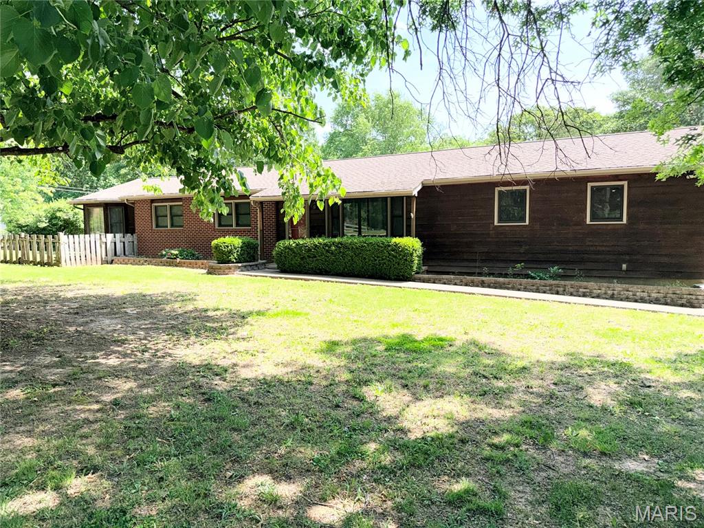 Escape to the peace of the country while still being just minutes from town in this beautiful one-owner home situated on over an acre with private wooded surroundings.  This spacious property offers 3 bedrooms, 3 full baths,  two living areas, and plenty of room to spread out both inside and out.
The oversized primary features two walk in closets, a private entrance to an outdoor deck, and a very large primary bath.  One closet in the primary offers a secondary washer/dryer hookup for your convenience.
There is space for an office or a 4th (non-conforming) bedroom.  There is a large family that over looks the beautiful back yard with a full brick wood-burning fireplace. 
Outside, you'll find both a two car attached garage as well as a large one car garage.  This secondary garage has ample space for a shop/hobby area as well as a wood burning stove and lots of overheard storage. This structure has concrete floors and electricity as well.   There is also a shed that will stay with the property. 
If you have been looking for the quiet county setting with convenience of being close to town, this property offers the best of both worlds! Schedule your showing today!
*Seller is offering $5,000 flooring allowance