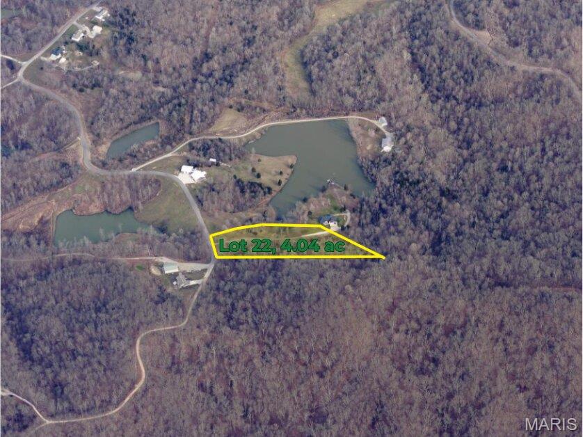 County Road 612 is a beautiful, secluded street in Cape Girardeau, located off of State Hwy V close to Proctor & Gamble.  This lot is 4.04 wooded acres in the rear of the subdivision.  Electricity is available.  Water well and sewer/septic required.  Reasonable building restrictions apply.  Build your own private dream home!  All boundary lines depicted are approximate.