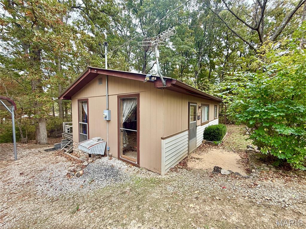 Charming 1-Bedroom Cabin on Two Lots in Goose Creek Lake Development – Perfect Getaway! Discover the perfect retreat with this well-maintained 1-bedroom, 1-bathroom cabin offering approximately 600 sq. ft. of comfortable living space. Nestled in a quiet cul-de-sac within the highly sought-after Goose Creek Lake development, this property provides the ideal blend of peace, privacy, and recreation. Situated on two spacious lots, this property offers plenty of room to relax and enjoy the natural surroundings. A covered carport provides convenient protection for vehicles, while the home’s meticulous upkeep ensures a move-in-ready experience for the new owner. Inside, you’ll find a cozy and inviting living area perfect for weekend getaways or year-round living. The efficient layout maximizes comfort and functionality, creating a warm and welcoming atmosphere. Step outside to your own outdoor oasis featuring a large back deck, ideal for gatherings, barbecues, or simply soaking in the peaceful scenery. As the sun sets, unwind around the cozy firepit, the perfect spot for roasting marshmallows and enjoying cool fall nights with family and friends. Goose Creek Lake is known for its beautiful, scenic lakes teeming with fish, making it a paradise for anglers and outdoor enthusiasts alike. Residents also enjoy access to several sandy beach areas, a public swimming pool, and a variety of recreational amenities that make this community one of the area’s premier destinations for relaxation and fun. This charming cabin offers exceptional value and an unbeatable opportunity to own a piece of paradise at an affordable price. Whether you’re seeking a peaceful weekend retreat or a permanent escape from the city, this Goose Creek Lake cabin truly has it all.