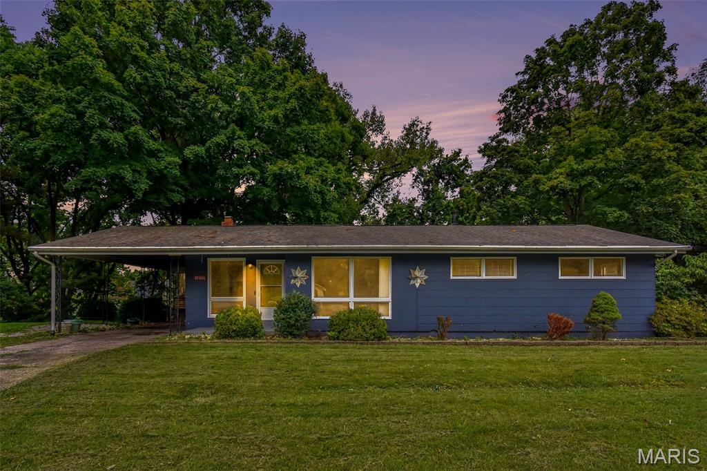 Welcome home to this charming ranch nestled on a quiet cul-de-sac in the heart of St. Ann! Set on a spacious, tree-lined lot, this home offers a wonderful blend of comfort, character, and opportunity. Step inside to find beautiful hardwood floors, a bright and inviting living room with a painted brick fireplace, and large picture windows that fill the home with natural light. The eat-in kitchen features abundant cabinetry, generous counter space, and expansive windows overlooking the private backyard. Enjoy the peaceful setting with mature trees, a covered carport, and a large backyard perfect for entertaining, gardening, or relaxing outdoors. Conveniently located near parks, shopping, restaurants, major highways, and Lambert International Airport, this home offers an excellent combination of location, value, and everyday convenience. Don't miss your opportunity to make this well-maintained home your own! Selling As/Is