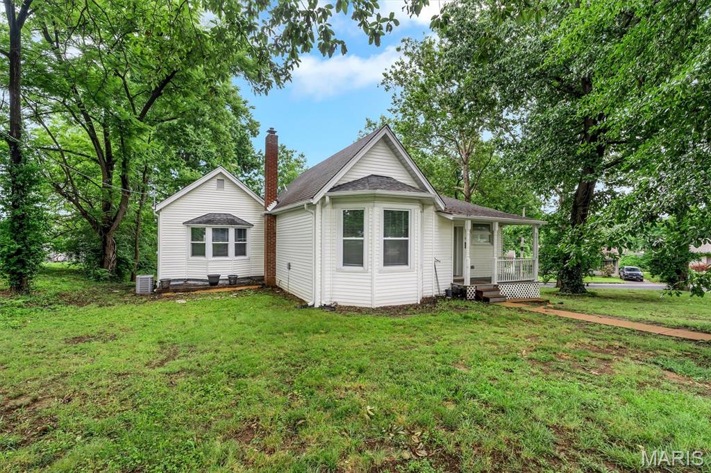 No showings until the Open House 12-2 pm on Saturday, July 11 - but you're gonna want to make sure you see this one! 
Super cute near-century home was completely remodeled in 2023 - roof, HVAC, water heater, windows, doors, plumbing & electric panel were all replaced, plus the hardwood floors were refinished, attic insulation was raised to R-49, the kitchen and both bathrooms are remodeled and gorgeous!  This "unicorn" of a smaller home tastefully updated with quality sits on a generous corner lot in a small, convenient, yet quiet neighborhood surrounded by mature trees that were recently thinned and pruned for enhanced health and maximum enjoyment.  Did I mention the attached tuck-under oversized 1-car garage with paved private drive?  As a bonus, the large lot next door is empty, so there's a TON of privacy!  Book your appointment NOW if you can't make the Open House!