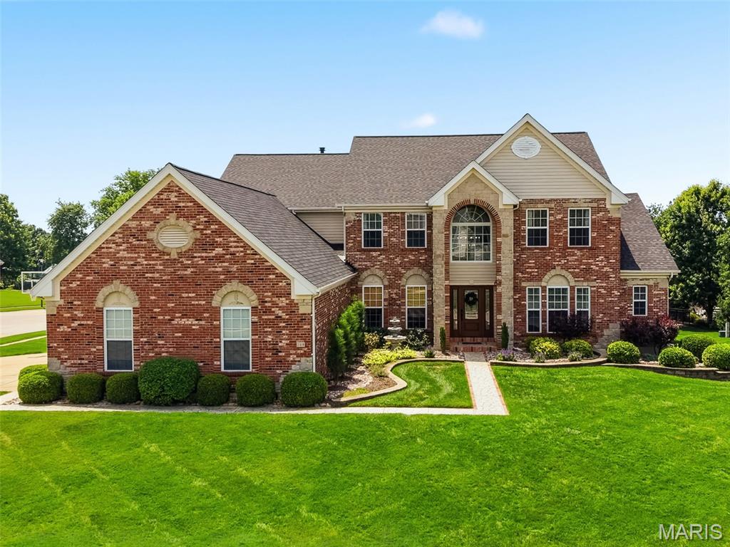Breathtaking 1.5 story sitting on almost 1/2 acre lot, walk in to refinished hardwood flooring, 2 story greatroom with wall of windows, gas fireplace, formal dining room and office, New custom kitchen in 2022 with custom cabinetry, counter, backsplash and appliances, all fresh paint throughout,  shiplap hearth room ceiling off kitchen with gas fireplace, custom plantation shutters in hearth room and LR, new lighting and ceiling fans throughout entire home, main floor laundry with HUGE OVERSIZED  4 car side entry garage, main floor master bath suite with custom shower and separate tub, double vanities, walk in closet, 3 large bedrooms uptairs with option to have other large room as game room/media room or 5th bedroom,  secret huge walk in closet in 2 bedroom perfect for dressing room,  full hall bath and jack n jill bath, BRAND NEW finished full walkout basement with rec/family room, gorgeous LVP flooring, tons of windows and canned lighting, workout room, built in sauna, complete full wet bar, full bathroom and plenty of storage space remaining, New deck in 2025, Updated landscaping and landscpaing lighting in 2025.  This home is truly one of a kind