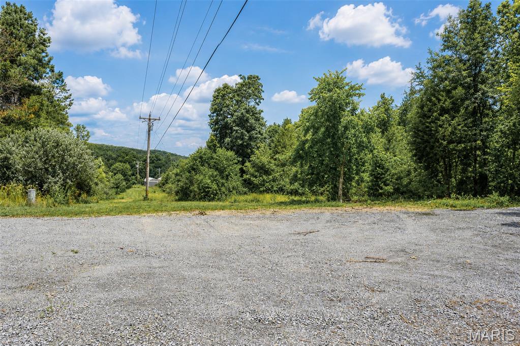 5 acres just outside of town! Located approximately 1 mile from Hwy 67 and only a few minutes from town, this property offers a great setup with plenty of potential. The property features electric, a well, and a 34x24 detached garage with potential. Whether you’re looking for a place to build, set up a manufactured home, or create your own getaway, this property has no restrictions and gives you the freedom to make it your own!