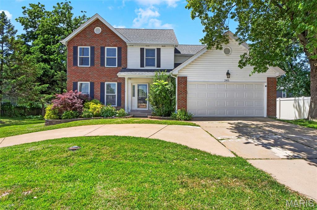 BALLWIN, ROCKWOOD SCHOOL DISTRICT! This traditional 2-story home is ready for YOU. Brick/vinyl front elevation is an inviting curb appeal style. Circle drive for easy road entry/exit! Located off right off Reinke Rd with easy access to Manchester Rd. 4-bedroom, 2.5 bath. Wood floors on main level. 42" custom cabinets in kitchen with granite countertops. Separate dining room AND an eat-in kitchen gives you choices for meals and entertaining. With a straight view from kitchen to the floor-to-ceiling stone decorated wood-burning fireplace, you will feel the open concept. Ceiling fans/lighting throughout. Upstairs you will find all 4 bedrooms! Primary bedroom with primary bathroom, 3 good sized secondary bedrooms and a full hall bath w/jacuzzi tub. Partial finished LL is ready for whatever else you would need! Step out back to the double tiered deck w/pergola. AHHHHHH. Move in ready with enough space to make things your own! LET'S GO!