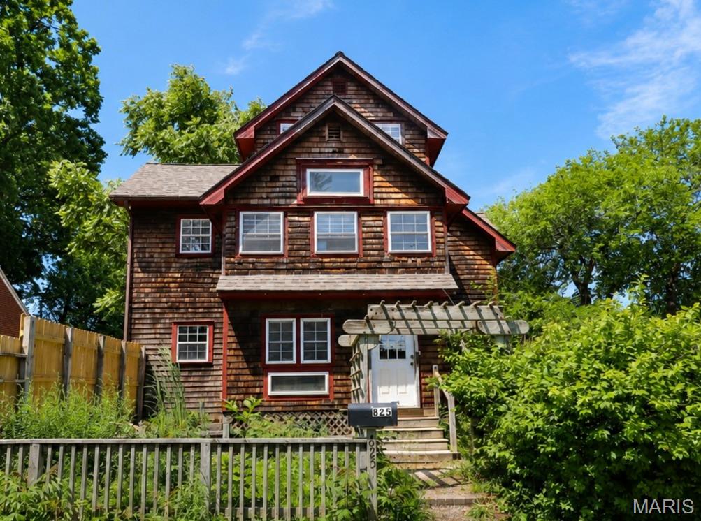 One-of-a-kind custom home with room for everyone! Set in the heart of historic Fulton, this distinctive, custom-built 3-story home delivers exceptional space and flexibility that's nearly impossible to find. Built in 2000, the property offers approximately 4,800+ sq ft of above-ground living area plus an unfinished 700+ sq ft basement (with an interior and exterior entrance), all wrapped in warm cedar-shake siding with signature red trim and lush, mature landscaping.
With 7 bedrooms, 6 bathrooms, 3 kitchens, and two laundry units, this home is built for multi-generational living, hosting extended family, or generating rental income. The main level showcases an open-concept layout anchored by a spacious kitchen with tile countertops and bar seating on both sides, flowing seamlessly into a generous dining area and a welcoming living room with a fireplace. Rich wood paneling, exposed beams, and gleaming hardwood floors give the interior genuine character throughout. A deck ramp provides easy, accessible entry to the main living space.
Upstairs, two bedrooms enjoy their own private bathrooms, and a second full kitchen makes ideal secondary living quarters. Two bright balcony-style rooms — one at the front, one at the back — are flooded with natural light through banks of windows, perfect for morning coffee or a quiet reading nook. Throughout the home, custom built-in shelving and abundant storage make organization effortless, while the many flexible rooms invite you to create offices, studios, playrooms, or guest suites to suit your needs.
Outdoor living is just as impressive. Relax on the covered front porch, enjoy the covered side porch that doubles as a sunny garden/greenhouse room, or entertain on the large patio featuring a built-in chimenea. A storage shed rounds out the exterior — ideal for gardening tools and weekend projects.
The home sits minutes from Fulton's beautiful Brick District with everyday conveniences and recreation. Nearby Veterans Park, 2 blocks away, is home to the City of Fulton Legends Rec-Plex (808 State Street), a 46,000 sq ft community center with a fitness center, gymnasium, indoor turf field, walking track, batting cages, and banquet space. Bush Elementary School, part of the Fulton 58 School District, is right beside the park — an easy walk for families.
Fulton is a vibrant college town, home to Westminster College and William Woods University, and a regional hub for employment. Major area employers include the Fulton State Hospital, the public school district, the universities, Walmart, and the Ameren Callaway Nuclear Plant about 13 miles southeast. For commuters, downtown Jefferson City is roughly 25 miles southwest (about 30 minutes), placing state-government jobs within easy reach, while Columbia lies about 25–30 miles to the west (around 30–35 minutes), offering the University of Missouri, major medical centers, shopping, and dining.
Whether you're seeking a spacious family residence, a multi-generational compound, or a property with built-in income potential, this remarkable home offers space, character, and an unbeatable central-Missouri location.
Square footage is approximate; buyers should verify all measurements, room counts, online data, zoning, and school assignments independently. Prospective buyers, please ensure you have a preapproval letter or proof of funds ready before scheduling a showing. Seller will have a survey to estimated boundaries on the attached aerial.