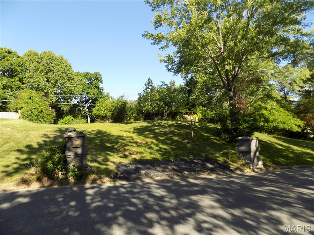 Spacious .66-acre double lot featuring a 1,120 sq ft walk-out basement foundation with 8-foot concrete walls already in place, offering incredible potential for your future build. Utilities are connected or readily available, making this property ready for your vision. The backyard includes a 360 sq ft concrete pad—perfect for a shed, workshop, patio, or even a basketball court. Located in a well-established neighborhood just minutes from shopping, schools, and everyday conveniences. Enjoy outdoor living with the Acorn Trail and a nearby park both within walking distance.