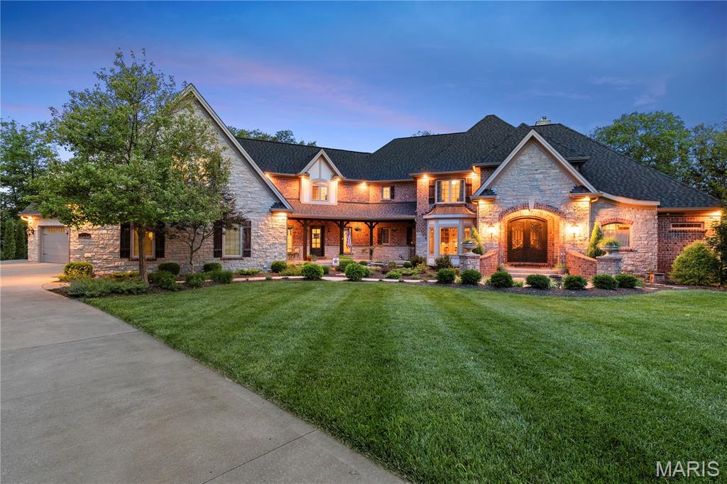 Tucked away at the end of a quiet cul-de-sac in one of Defiance’s most sought-after communities, 701 Crown Pointe Farms offers unmatched privacy and space—all set on 10.39 wooded acres. This breathtaking estate boasts over 9,000 sq ft of finished living space, including a separate in-law apartment and an entertainer’s dream of a lower level. The resort-style backyard features a heated & cooled saltwater pool with a waterfall and tanning ledge, separate hot tub, firepit area, and a large covered deck with serene views of the surrounding acreage. Inside, the main floor showcases a grand entry with a custom door, soaring 2-story great room, French-inspired chef’s kitchen, formal dining, and an oversized laundry/mudroom. The luxurious main-floor primary suite includes a bay window overlooking the peaceful landscape, a private coffee bar, and spa-like bath with soaking tub and walk-in shower. Upstairs offers 3 spacious bedrooms and 2 full baths. The private in-law quarters/apartment above the garage includes a family room, dining area, bedroom, full bath, and kitchenette rough-in. The finished walkout lower level impresses with a 10' pour, stone fireplace, full bar, movie theater, gym, and office, blending comfort and entertainment perfectly. And to finish it off, the roof is only one year old, the home is split into four HVAC zones and the home is technology ready, wired w/ Cat6 cable throughout. This is a one-of-a-kind retreat just minutes from wine country & top-rated schools.