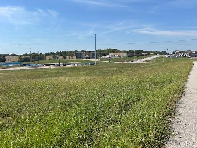 Situated on Highway 61, this 3.66-acre property offers nearly 500 feet of highway frontage and is conveniently located near I-55. With public streets bordering all four sides, this versatile property enjoys high visibility and accessibility, making it suitable for a variety of businesses. Additionally, city utilities are readily available, further enhancing the property's appeal for development.
