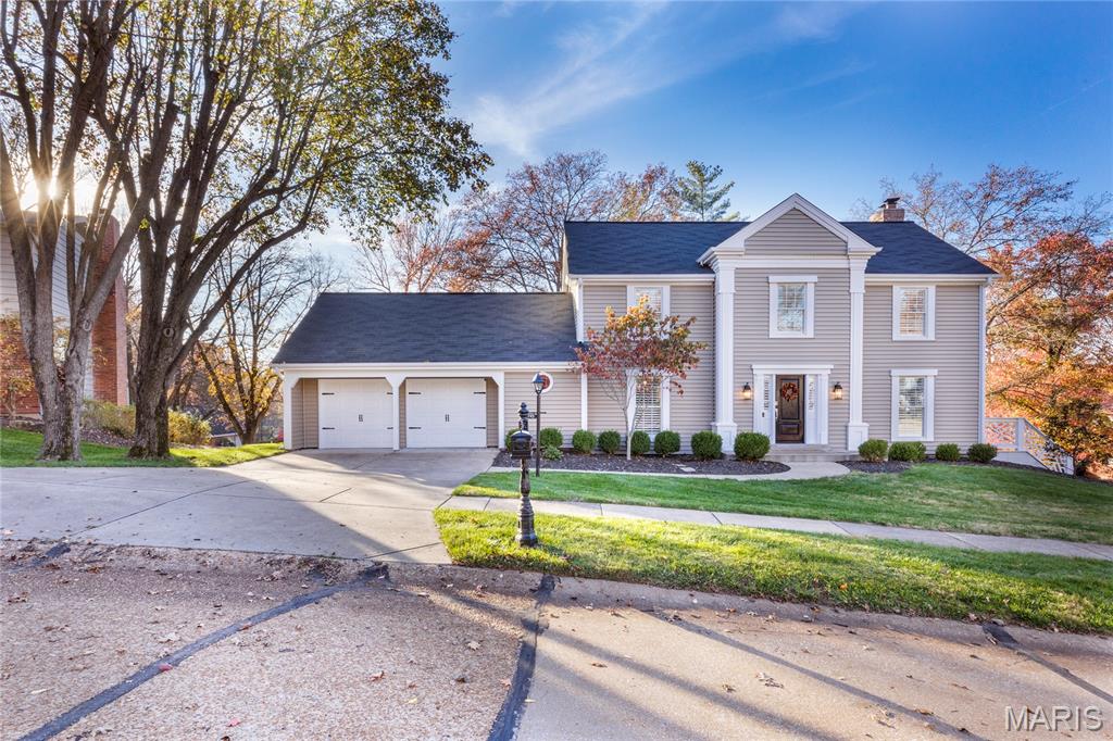 Situated on a beautifully landscaped corner lot with exceptional curb appeal, this stunning home blends timeless elegance with modern luxury. Sun-filled rooms and expansive windows create a warm, inviting atmosphere throughout, while refined finishes and plantation shutters elevate every space with sophistication and style. The elegant office with French doors offers the perfect private retreat for work or study. Designed for both comfort and functionality, the home features a spacious main floor laundry and mud room ideal for everyday living, along with an oversized 2-car garage offering ample storage and convenience. Retreat to the luxurious primary suite featuring double sinks, a soaking tub, and a custom walk-in closet designed for both style and organization. All baths have been thoughtfully updated with today’s sought-after finishes and designer touches. The finished lower level opens seamlessly through French doors to a private patio, creating the perfect setting for entertaining or relaxing indoors and out. Every detail of this home has been thoughtfully designed to offer luxury living at its finest.