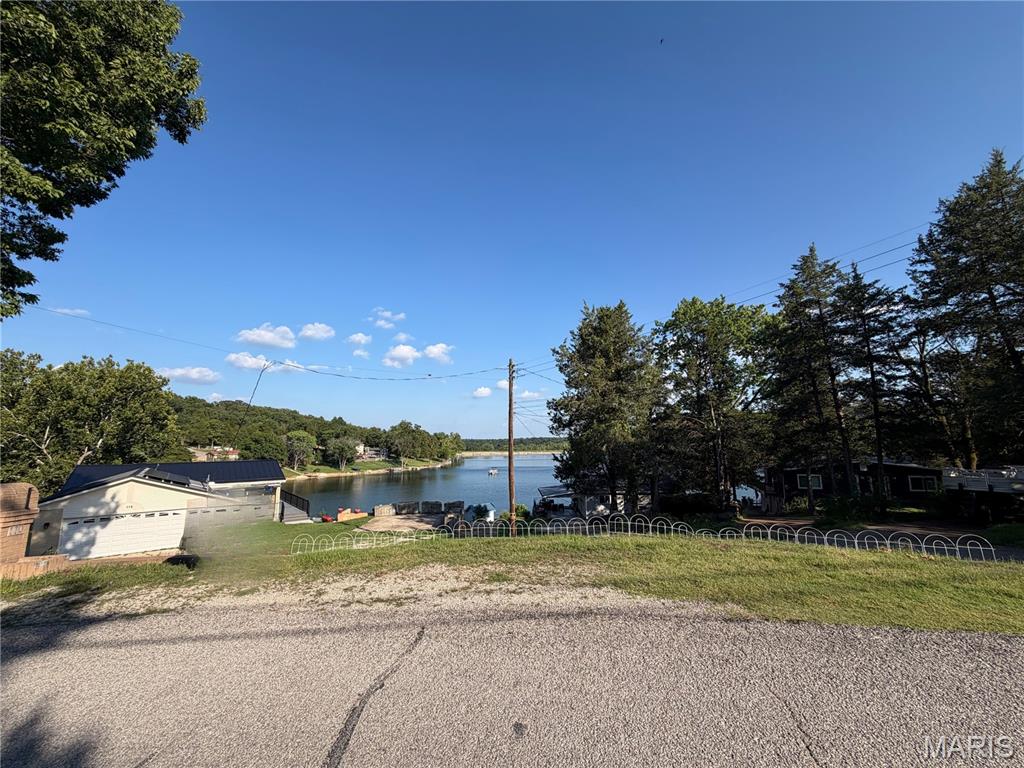 Welcome to the lake life! Discover the perfect setting for your future dream home on this beautiful lake view lot offering nearly 3/4 of an acre in Lake Wauwanoka, one of the area's most sought-after gated communities. Thoughtfully laid out on a gently curving corner lot with an excellent building site, this property captures stunning views of the lake and provides the ideal backdrop for peaceful mornings and unforgettable sunsets.
Beyond the property itself, you'll enjoy an incredible lifestyle with access to several hundred acres of common ground for hiking, riding, hunting, exploring the outdoors, and numerous annual community events. Spend your summers relaxing on the sandy beach, enjoying the lake, or gathering with friends and family at the community clubhouse for larger celebrations. Nature lovers will also appreciate the abundant wildlife, including frequent bald eagle sightings that make this community truly special.
Whether you're ready to build now or invest in your future, opportunities like this don't come along often. Come experience everything this exceptional lake community has to offer and make this breathtaking property your own.