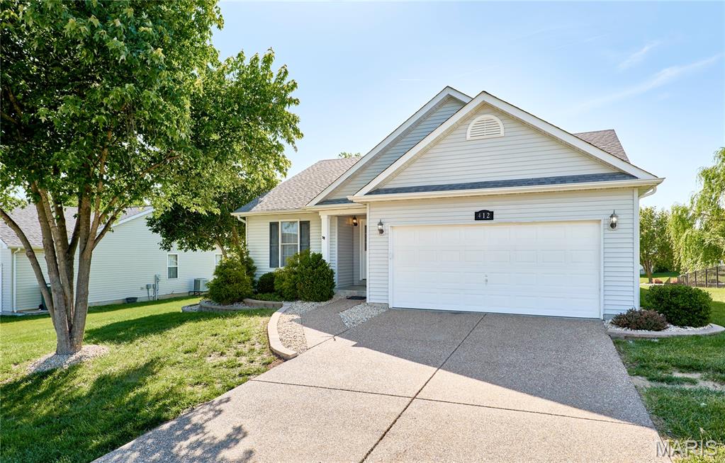 There is wonderful curb appeal with fresh landscaping at this 3 bedroom, 2 bath Ranch home in Stone Meadows subdivision. You are greeted with rich bamboo flooring throughout entry foyer, Great Room & the hall. The Great Room/Dining area is vaulted and has a corner woodburning fireplace. The kitchen has an open breakfast bar area, black/stainless appliances (all newer but fridge), oak cabinets and pantry.  Primary bedroom suite has a walk-in closet and adjoining master bath with dual sinks, separate tub & shower & linen closet. There are 2 additional good sized bedroom and another full bath. Convenient main floor laundry, basement with rough-in plumbing, vinyl siding & enclosed soffits. Other features include newer HVAC, aggregate driveway, new fixtures throughout, fresh paint throughout, new 2" white blinds, and so much more! ALSO- enjoy the subdivision pool, clubhouse, fishing lakes, and walking trails!