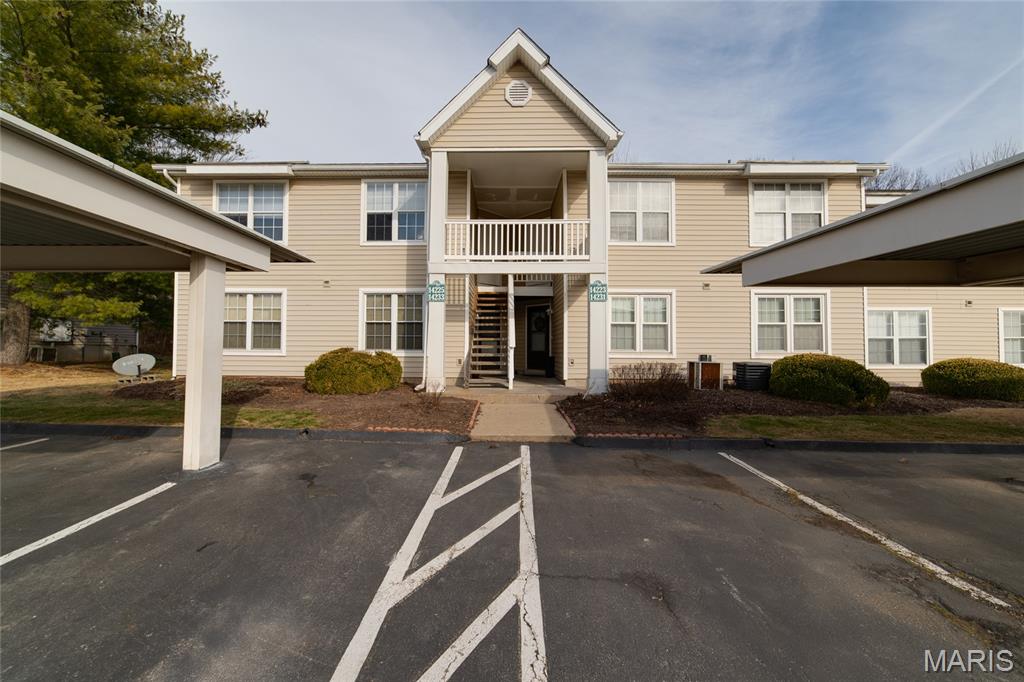 This is the ONE you've been searching for! This awesome Condo has been freshly updated to be like new for YOU! The moment you step in you will be WOWED by the bright feel and chic decorative wall and new luxury vinyl floors that continue throughout. The kitchen features a stainless steel dishwasher, microwave, electric stove/oven, refrigerator & beautifully painted cabinets. Enjoy your morning coffee out on private deck as you watch spring come to life! Primary bedroom is massive and offers dual clostets. The second generous bedroom could also serve as an office or serene reading nook! This wonderful unit is completed by its laundry room & assigned COVERED parking to keep you out of the elements. Maintenance FREE living - Including water, sewer, trash and a POOL for hot summer days! This Condo has everything you could want! Kick back & relax! Home Sweet Home!