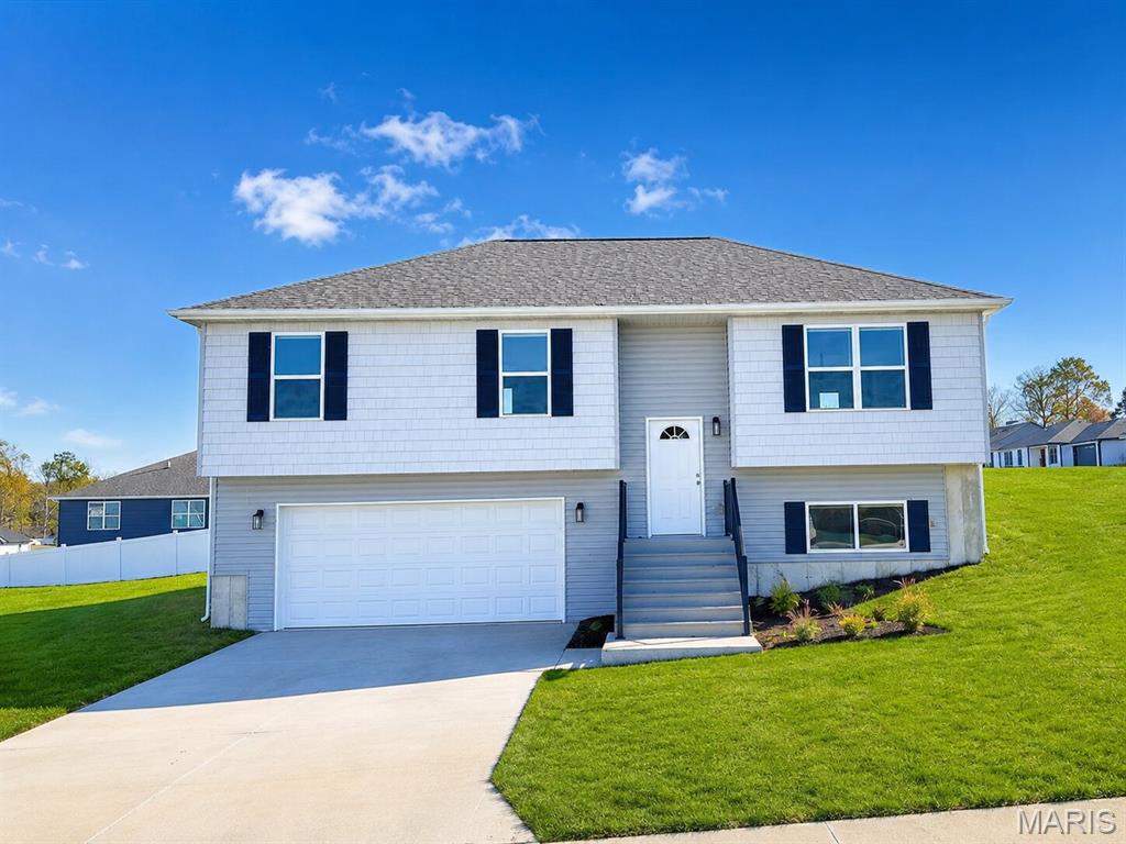 COMING SOON! HOME IN PROGRESS! #UNIONMO.  A VERY SPACIOUS MULTI-LEVEL HOME TO FALL IN LOVE WITH!! A Quality New Construction home with so much to offer. This is the type of floor plan that provides a lot of bang for the buck. A very stylish multi-level design featuring great curb appeal, with partial pewter board-and-batten siding in the front bump-outs, white horizontal siding, board-and-batten shutters, a wide driveway, a gorgeous front door, a black aluminum rail system at the front entry & more. Home comes equipped with a 2 car oversized garage with black door with glass windows, nice sod lawn, rear patio, front porch with composite decking and black railing system, 4 beds x 3 full baths, plenty of square footage, a large living room with elegant ceiling fan, LVP flooring, a spacious kitchen with plentiful gray stained cabinets & a sleek Quartz countertop design, built-in dishwasher & microwave, a single door with half glass and built in blinds to the rear patio and much more. The grand primary suite includes dual closets, a large gray-stained vanity, and a tub & shower. A large Lower Level 4th bed with entry landing from garage, having a nice closet for coats & shoes, laundry/storage area & 3rd full bath.  The home will have 9' house walls throughout the main floor with an upgraded taller trim package.  ELS HOMES - LOCAL BUILDER AT ITS FINEST - #ELSHOMES