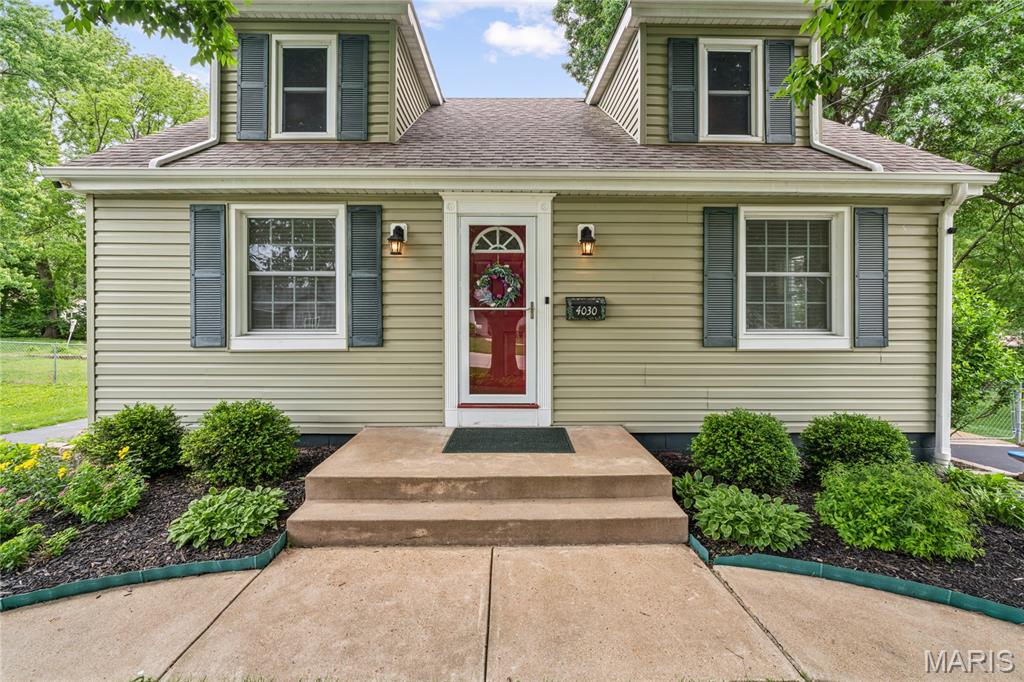 Second chances like this rarely come along.  Home is back on the market due to no fault of the Seller. Some homes are houses. This one is a legacy.  For over 40 years, 4030 Jane has been the kind of address people brag about at block parties. A multi-time Neighborhood Beautification Continuous Award winner, this Cape Cod bungalow sits on nearly half an acre of mature, sanctuary-level grounds where deer wander through like they own the place. (They don't. But you will.)  Pull up to one of the two freshly resurfaced driveways (2022) and let the setting sink in. Towering mature trees. A fully fenced and double-gated yard. A covered outdoor pavilion with concrete floors. R t etaining walls with steps leading down to the walk out basement. A white picket garden fence surrounding the sunlit garden ready for the spring planting. A massive shed with electric and extra storage. This yard is not a yard. It is a homestead, and it is ready for its next visionary.

The house? Just as dialed in. The kitchen earns its keep with Corian countertops, Wainscoting, LVP flooring, light dimmers, stainless gas range, built-in microwave, Bosch dishwasher, and an eat-in layout that makes every meal feel intentional. The main floor bathroom has been refreshed with a newer vanity, comfort height toilet, and tub/shower combo. The main floor bedroom features new lighting fixtures with 2 windows overlooking your slice of paradise. Upstairs you will find spacious bedrooms with bump-out dormer windows, spacious closets, and a loft/bonus room with built-in storage that flexes for whatever your life demands.  The basement is clean, dry, functional, and frankly impressive with a newer brick paver patio heading out into the stunning yard.  

Now let's talk about the systems, because this home is not just beautiful. It is smart.
Lennox High Efficiency Furnace (2023). Lennox HVAC (2023). Hot water heater (2011). Smart Lennox thermostat. Double pane Anderson windows (2011). 200 amp Carter Hawkins panel. PVC plumbing throughout. The big ticket items are handled. Move in and live your life.

The location is a Chef's kiss. Minutes to ABC Ballpark for summer nights out and a straight shot to Lambert International when life calls you elsewhere. Saint Ann delivers convenience without sacrificing the quiet, tree-lined, sanctuary energy this property has in spades.

This home is turn-key, loved, and ready. The only thing left to do is make it yours.  Showings begin 5/28. Open house 6/31. Offers will move fast on this one.  Call your agent now. Seriously. Right now.