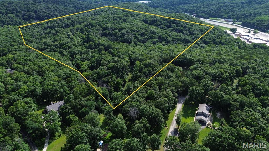 Opportunities like this are becoming increasingly rare. This exceptional 54.21± acre tract combines the beauty of mature Missouri hardwoods with extensive groundwork already completed for future development, making it an outstanding investment, private estate, or family compound.

Years ago, the property underwent significant improvements, including the installation of an access road and substantial clearing to showcase multiple incredible ridgetop homesites. While nature has reclaimed portions of the road, the infrastructure remains in place and provides an excellent starting point for future improvements.

Even more valuable, extensive engineering work—including soil testing and development planning—has already been completed, saving a future owner considerable time, expense, and uncertainty. Preliminary concepts included both approximately 4-acre estate lots, 10-acre estate lots, and a larger 22-acre division, offering flexibility for residential development or a private family retreat.

Towering mature hardwoods now blanket the property, creating a beautiful park-like setting filled with wildlife. Numerous deer trails weave throughout the rolling ridges and valleys, making this an excellent recreational property while also providing incredible privacy for future homesites. The elevated ridges offer outstanding locations for custom homes with scenic views across the surrounding countryside.

Access is provided by a deeded easement from Monticello Court, allowing the property to feel secluded while remaining conveniently located near shopping, schools, and Interstate 55.

Whether you're a developer looking for a project with much of the preliminary work already completed, an investor seeking a rare land holding in Jefferson County, or someone searching for the perfect location to build a private estate, this property offers possibilities that are increasingly difficult to find. Owner financing is available.
