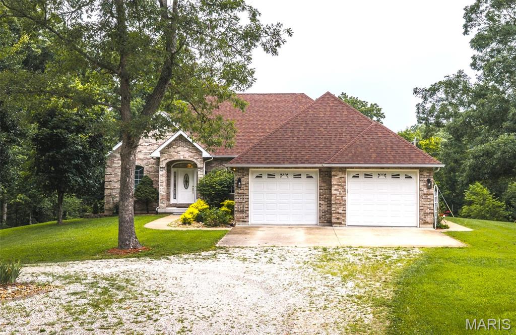 Welcome to this beautiful 4-bedroom, 4-bath home nestled on 13.6 acres just outside Cuba, MO! Step inside to an inviting open-concept living and dining area filled with natural light and featuring a cozy electric fireplace. The adjoining eat-in kitchen offers abundant cabinet space and a bright bay window, creating the perfect setting for everyday living. The spacious primary suite provides a private retreat with a large walk-in closet, while two additional main-level bedrooms are connected by a Jack-and-Jill bath with a double vanity. The finished walkout basement offers endless possibilities with a generous family room, an additional bedroom and full bath, plus bonus rooms ideal for storage, hobbies, or a home office. Enjoy peaceful country views from the upper-level deck or the concrete patio below. Outside, you'll find a 40x35 outbuilding and an additional storage shed w/ wood burning furnace. Both outbuildings can provide plenty of room for equipment, workshop space, or recreational toys. With over 13 acres to explore, this property offers the perfect blend of comfort, functionality, and privacy. Schedule your private showing today!