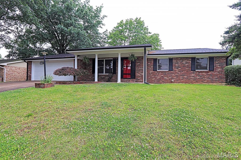 Under $300K budget...this checks all the boxes.  Full brick ranch gives you main level kitchen & dining combo with warm wood custom cabinets, main level laundry large enough to include a pantry & 2 baths with updated showers.  Walk out  back to an impressive covered patio ready to host a summer BBQ or watch a game on your open air theater, TV included-The partially finished basement will expand your living area with a walk out family room, office area, work out room or indoor theater and 3rd updated bath.  In recent years many updates to include heat & AC, main water line, windows, gutters, paint.  Alma Schrader grade school.  Flat fenced yard good location for pool.  This quiet, low traffic street in Northwood Hills is great for playing with you kids, walking your dog or going for that daily run.  Life is good here.