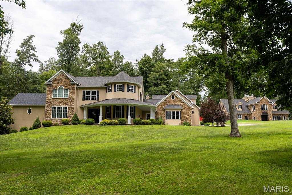 Custom-built 14-acre property located just minutes from Farmington, offering a unique combination of residential living and potential business opportunities. The main residence features 4 primary suites, including one on the main level with a private bath. Two upper-level suites include large showers and jetted/bubble tubs, while a fourth private suite is located above the garage. The home also offers a chef's kitchen with custom cabinetry, granite countertops, a formal dining room, and a spacious great room with a gas fireplace.  30' above ground pool is off the great room.  

A separate building previously operated as an event center and bed and breakfast and features a grand staircase, 2 additional primary suites, a kitchenette.  A full kitchen is also featured on the main level.  The property also includes a stocked pond along with an additional heated/cooled outbuilding providing ample storage space for equipment, hobbies, or workshop use.  Also features a 20,000 KW Diesel Generator with manual disconnect.  

The microwave/convection oven in the event center kitchen does  not stay with the sale of this listing.  All furniture, decor, personal property and pictures shown in the home are excluded from the sale of the property, unless otherwise negotiated and agreed upon in writing by the buyers and sellers.  

This versatile property offers numerous possibilities for residential, retreat,  recreational, or business use. Homeowner requests a minimum 24-hour notice for all showings.