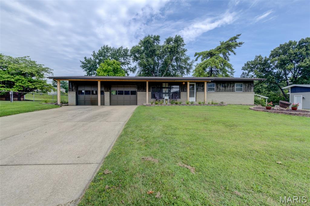 Move in ready with your own 20,000 gal. pool to enjoy the summer!  Recent updates include:  roof, gutters, downspouts, electric panel and outlets, pool pump and wiring, painting, and landscaping.  Beautiful original hardwood floors in the living room and all 3 bedrooms.  Lower level with large rec area and bonus room that could be an office or craft room.  Enjoy the view of the huge back yard and pool from the screened in porch.  The location is amazing - literally just minutes to shopping, restaurants, and highways.  Don't miss this one!