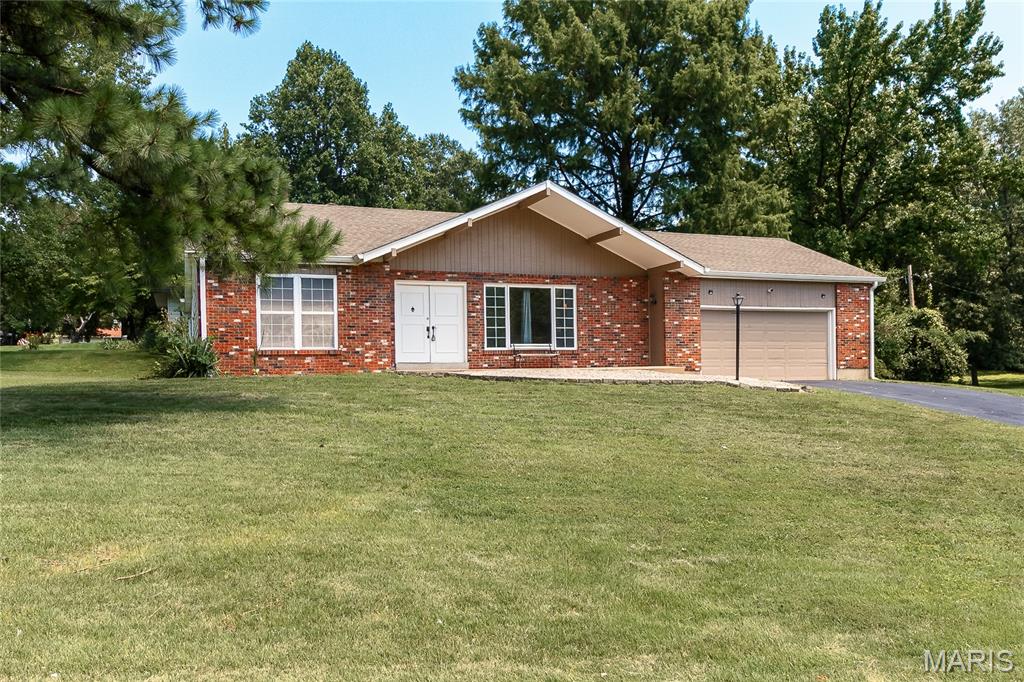 Welcome home to this spacious 3-bedroom, 2-bath ranch tucked away in a quiet, secluded subdivision. Situated on just over a half-acre lot, this home offers the perfect combination of privacy, comfort, and room to grow. 
Step inside to find luxury vinyl plank flooring flowing through the living room, dining room, and family room, creating a stylish and low-maintenance living space. The kitchen is designed for both everyday living and entertaining, featuring granite countertops, stainless steel appliances, and a convenient breakfast bar.
Additional features include a 2-car attached garage and a full basement with endless potential for storage, a workshop, or future finished living space. Outside, the expansive backyard provides plenty of room for gardening, play, or relaxing in a peaceful setting. Don't miss the opportunity to make this inviting ranch your next home!