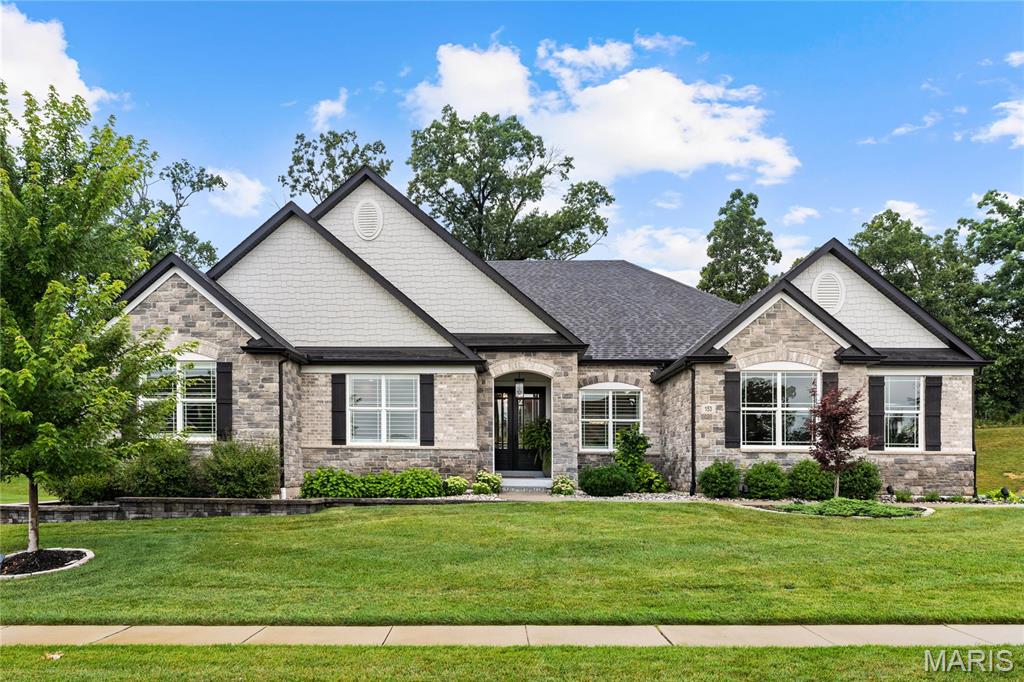 Beautifully designed and extensively upgraded, this exceptional great room ranch by Lombardo Custom Homes is located in prestigious Westleigh and showcases distinctive architectural details, luxurious finishes, and thoughtful enhancements throughout. Expanded during construction, the home features soaring ceilings, wide-plank French oak hardwood floors, contemporary designer lighting, and plantation shutters. A magnificent set of 8-foot solid wood double entry doors opens to an impressive foyer that welcomes you to a private study, elegant formal dining room, and a spectacular great room highlighted by a soaring 12-foot ceiling, floor-to-ceiling stone fireplace with custom built-in bookcases, and a dramatic wall of windows overlooking the outdoor living spaces. The designer kitchen is appointed with 42-inch white Shaker cabinetry, Taj Mahal quartzite countertops, Wolf appliances, an oversized 8-foot center island, and a well-equipped butler's pantry. The adjoining breakfast room opens through sliding glass doors to an incredible covered outdoor living area featuring a stone fireplace, outdoor kitchen, and tongue-and-groove wood ceiling. The luxurious primary suite offers a tray ceiling and spa-inspired bath with a freestanding soaking tub, while two additional bedrooms and a beautifully appointed hall bath complete the main level. Designed for entertaining and everyday living, the finished lower level featuring a 9' foundation pour includes a spacious recreation room with gathering bar, game room, fitness room, dedicated craft room, second laundry, fourth bedroom, and two full baths. Situated on a private half-acre cul-de-sac lot, the outdoor amenities are equally impressive, featuring a covered patio with direct access to an outdoor half bath, hot tub, beautifully landscaped grounds, and an oversized three-car garage.