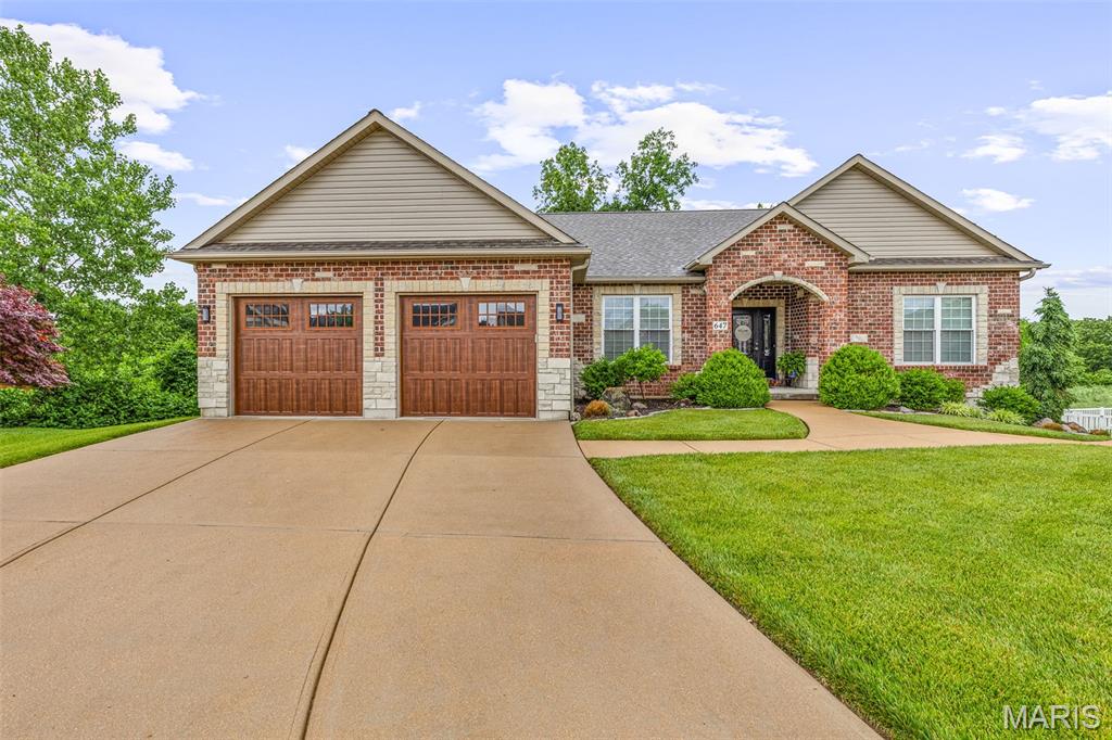 SHOWSTOPPER HOME!  You know the feeling you get when you step inside a house and its inviting, comfortable and makes you want to linger?  THIS HOME HAS ALL THAT AND SO MUCH MORE!  Beautiful custom ranch-style home featuring 3 bedrooms, 3 full bathrooms, and a finished walkout lower level. This thoughtfully designed residence offers a spacious and functional layout with quality finishes throughout.  SO MUCH ATTENTION TO DETAIL!
The main level includes a formal dining room with tray ceiling and crown molding, a large living area with a brick gas fireplace, and a well-appointed kitchen with ceramic tile flooring, breakfast bar, and adjoining breakfast room with abundant natural light from large windows. Convenient main-floor laundry adds to the home’s functionality.  The finished walkout lower level expands the living space with a family room, wet bar, and access to a covered stamped concrete patio—ideal for additional entertaining or relaxation.  All bedrooms are generously sized and feature walk-in closets. Additional highlights include an iron spindle staircase, extended height vanities, atrium doors, surround sound, hard surface countertops, a maintenance-reduced deck, covered front porch and an oversized two-car garage.  Recent updates include a new roof, siding, and HVAC system.
Situated on a cul-de-sac, this property offers a desirable location with a well-designed indoor and outdoor living space.  
DON'T LET THIS ONE GET AWAY!